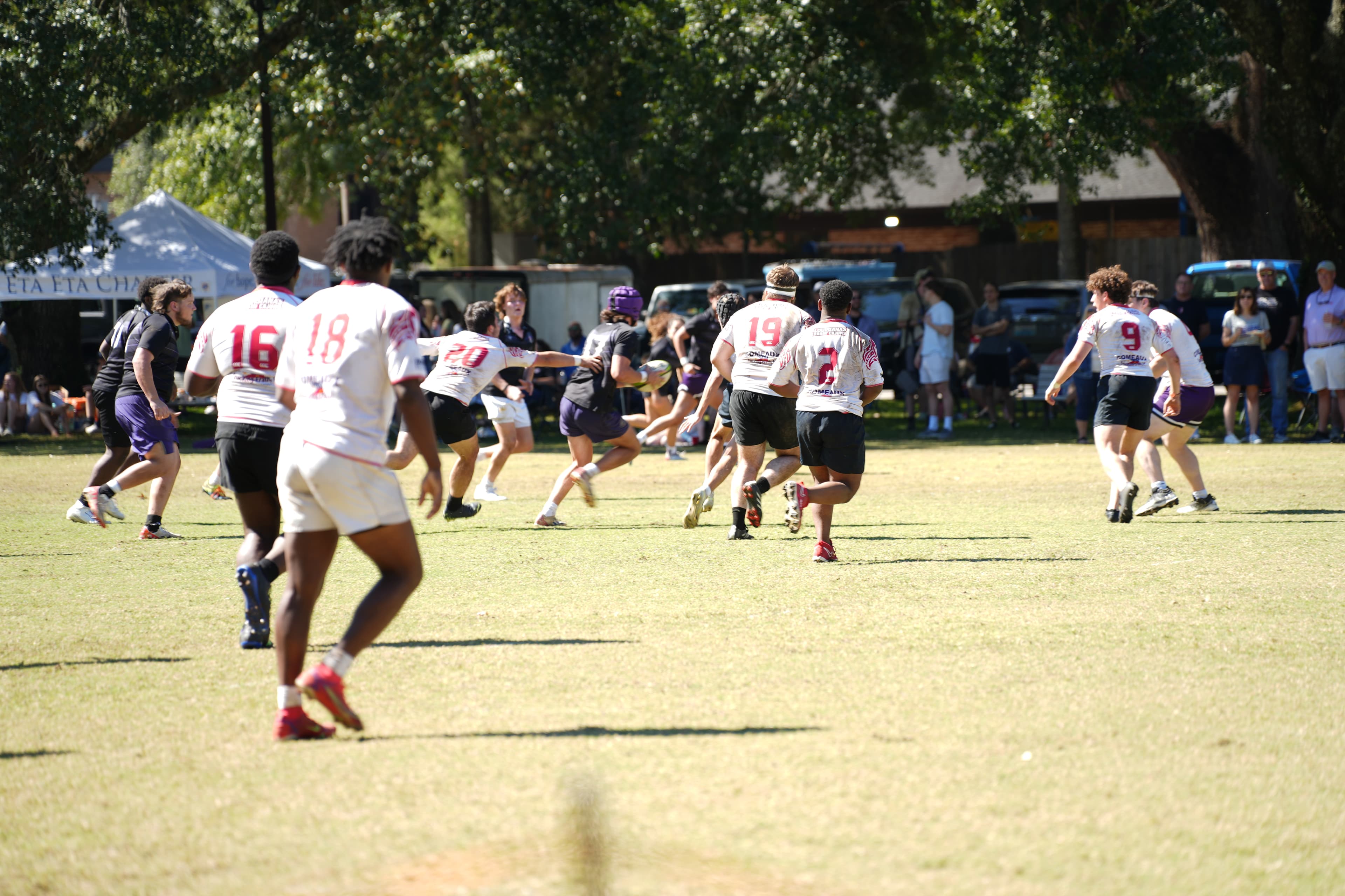 Spring Hill Badgers in open play, chasing down a ball-carrier on match day