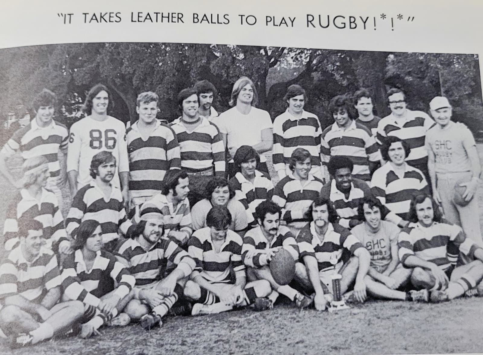 Yearbook page showing the 1970s SHC Rugby Club posing with a trophy on the field